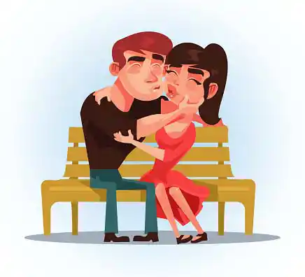 A man and a woman sitting on bench and kissing